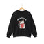 A black crewneck sweatshirt featuring a cartoon graphic of a gray tabby cat holding a red heart, with the text 'ADOPT LOVE' printed above it in white for cat lovers.