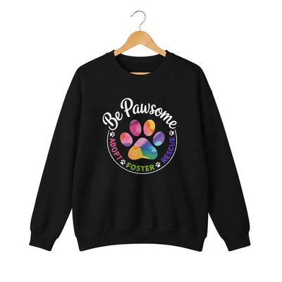 Black crewneck sweatshirt featuring a colorful paw print for cat rescue advocates with text 'Be Pawsome Adopt Foster Rescue'.