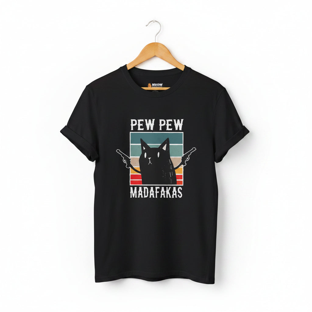 A black short-sleeve crewneck t-shirt with a graphic print of a black cat holding two pistols, set against a retro sunset background with the text 'PEW PEW MADAFAKAS'.