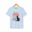 Light blue short-sleeve t-shirt on a wooden hanger with green and red text saying "Dear Santa, it was the Cat" featuring a black cat silhouette.