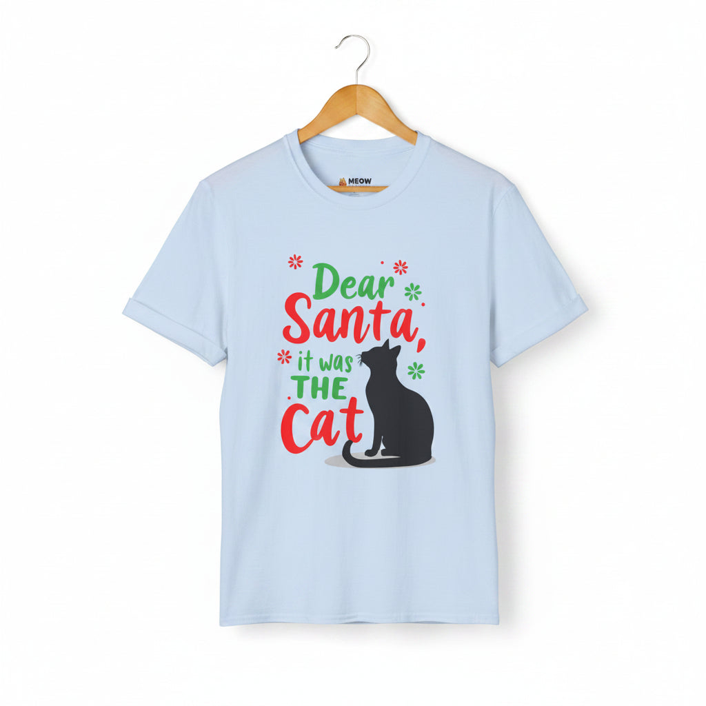 Light blue short-sleeve t-shirt on a wooden hanger with green and red text saying "Dear Santa, it was the Cat" featuring a black cat silhouette.