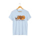 Light blue unisex graphic t-shirt with vintage Kitty Barrel logo, tabby cats, and 'MEOWY CATTY HABITAT' text.