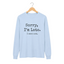 A light blue long-sleeve t-shirt with the text 'Sorry, I'm Late. I saw a cat' for cat lovers.