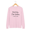 A light pink long-sleeve t-shirt with the text 'Sorry, I'm Late. I saw a cat' for cat lovers.