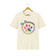 Natural cat rescue t-shirt featuring a rainbow paw print graphic with text 'Be Pawsome Adopt Foster Rescue'.