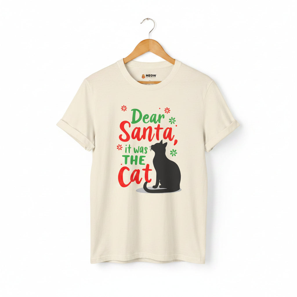 Natural short-sleeve t-shirt on a wooden hanger with green and red text saying "Dear Santa, it was the Cat" featuring a black cat silhouette.