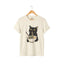 Natural t-shirt with a black cat eating ramen graphic.