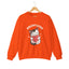 An orange crewneck sweatshirt featuring a cartoon graphic of a gray tabby cat holding a red heart, with the text 'ADOPT LOVE' printed above it in white for cat lovers.