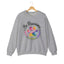 Sport grey crewneck sweatshirt featuring a colorful paw print for cat rescue advocates with text 'Be Pawsome Adopt Foster Rescue'.