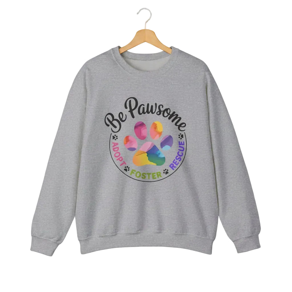 Sport grey crewneck sweatshirt featuring a colorful paw print for cat rescue advocates with text 'Be Pawsome Adopt Foster Rescue'.