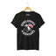 Black unisex short-sleeve t-shirt with a graphic of a cartoon cat holding an American flag and the text 'STARS, STRIPES & SCRATCHES'.
