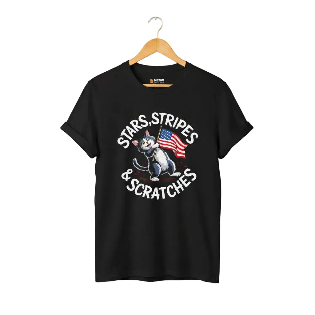 Black unisex short-sleeve t-shirt with a graphic of a cartoon cat holding an American flag and the text 'STARS, STRIPES & SCRATCHES'.
