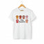 White Stay Pawsitive t-shirt with colorful cat paws illustration for cat lovers.