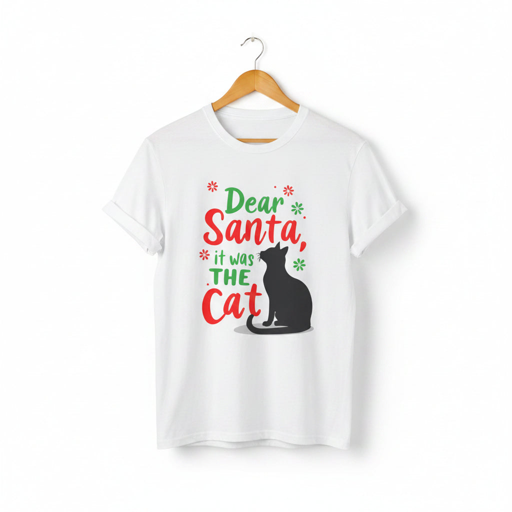 White short-sleeve t-shirt on a wooden hanger with green and red text saying "Dear Santa, it was the Cat" featuring a black cat silhouette.